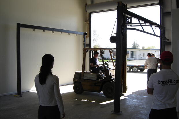 Moving our giant pull up/rope climb structure from the Red Egg building to our new home on Norfield. (This structure has been cut down and moved twice). 