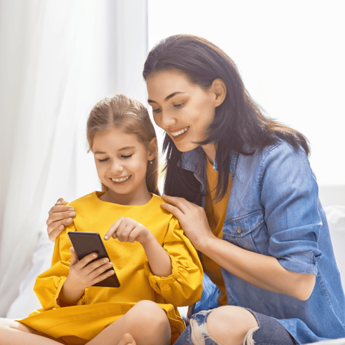 Mom and Daughter looking at Phone