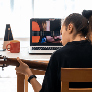 girl with guitar and laptop